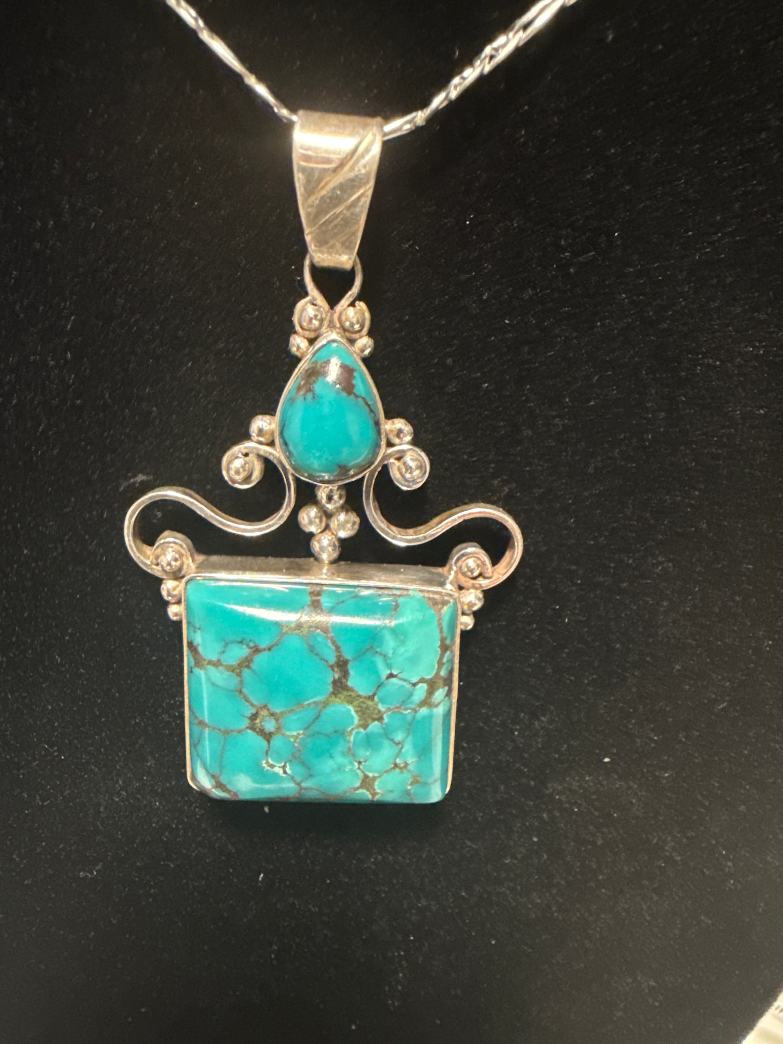Two stone Nevada spiderweb, turquoise designer pendant with Italian chain.