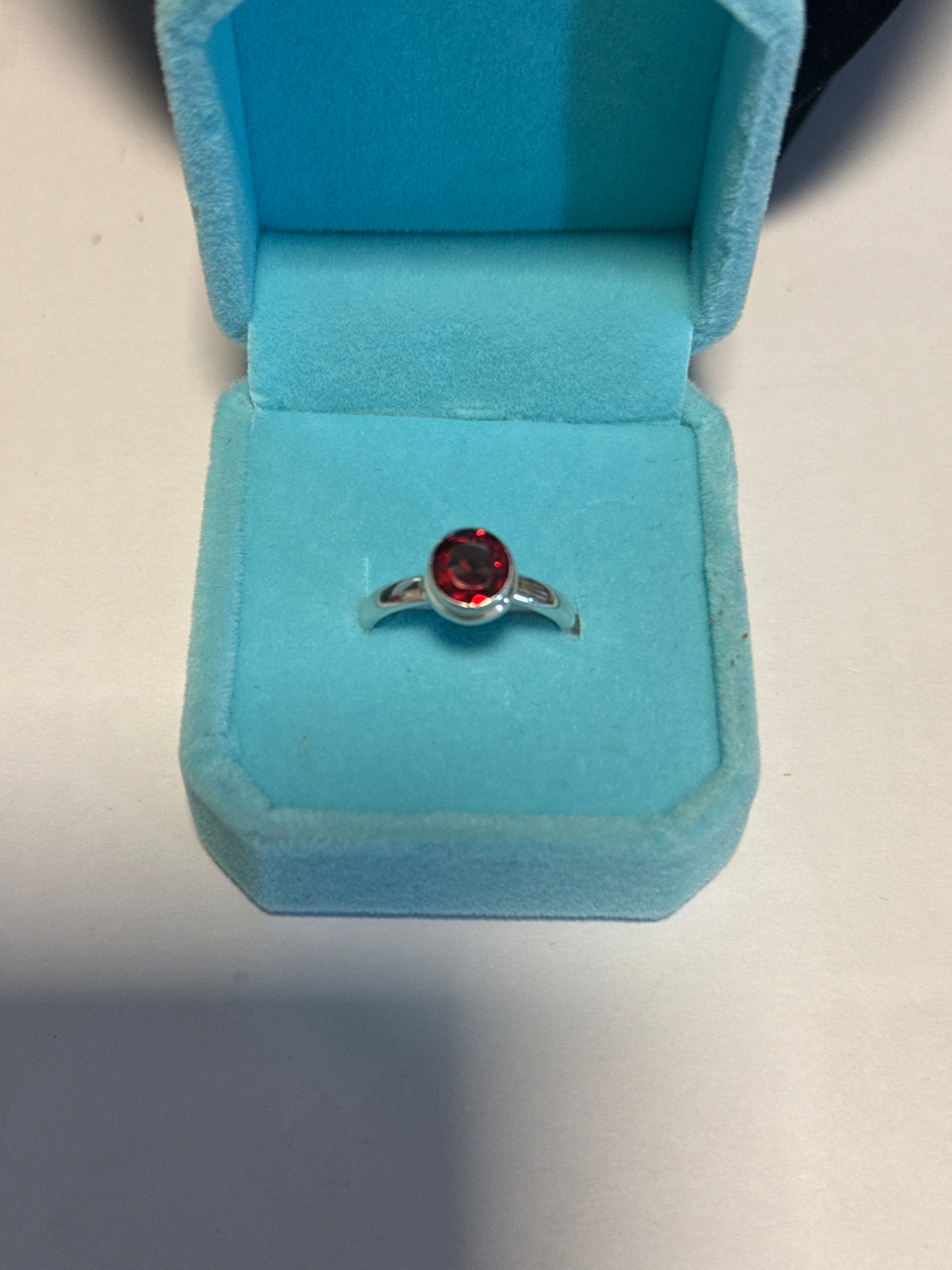 Mozambique facet round Garnet sterling silver ring