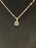 3ct facet Ethiopian black opal set in Sterling silver with 20 inch wave chain